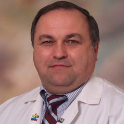 Dr. Russell   Dumire MD