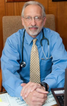 Dr. Kenneth Eli Mancher  M.D.